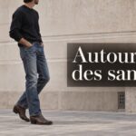 Homme en tenue urbaine sobre, jean droit et santiags, avec le texte « Autour des santiags » affiché en surimpression.